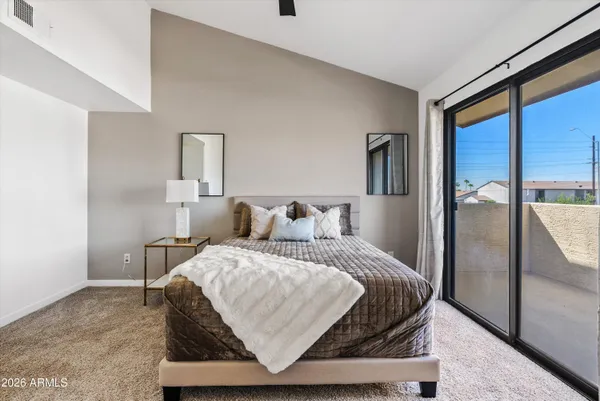 a bedroom with a bed and window