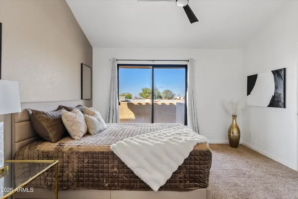 a bed room with a bed and a mirror