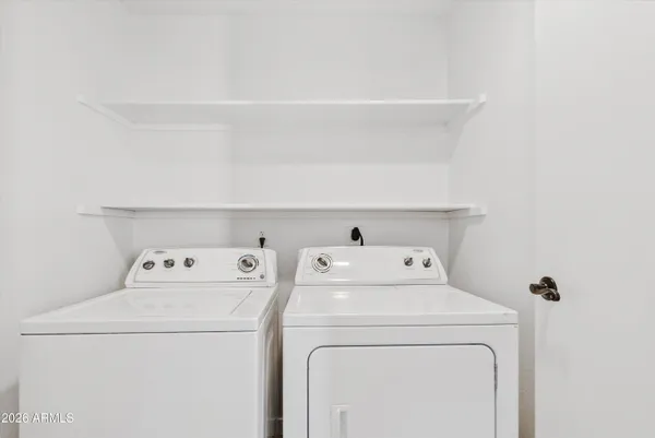 a view of a swimming pool and a chairs