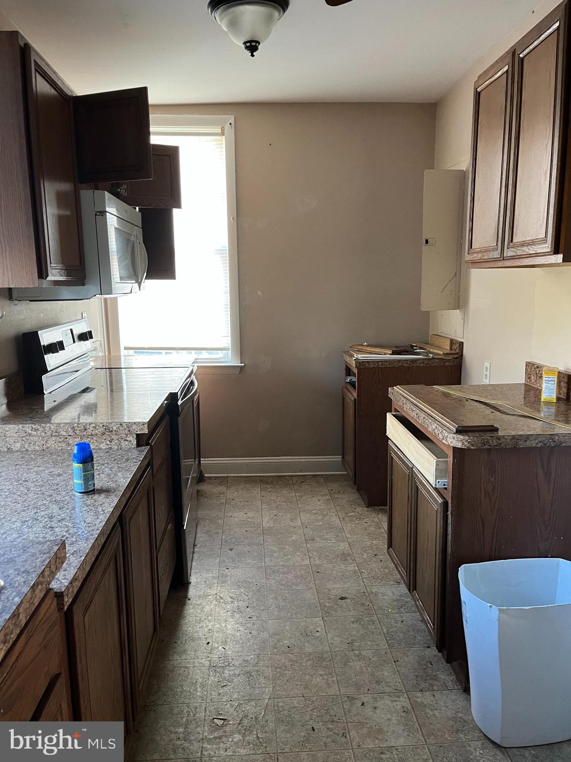 223-225 West High Street Elkton, MD 21921 - Photo 15 of 21 a kitchen with a sink appliances and cabinets