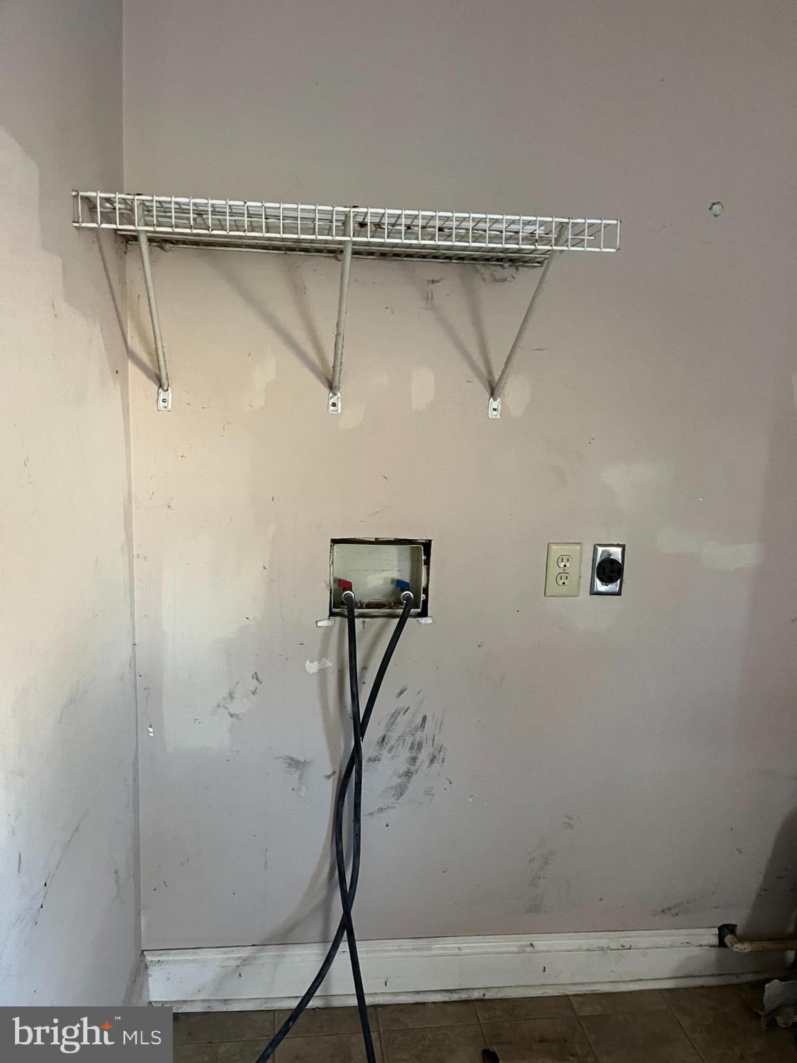 223-225 West High Street Elkton, MD 21921 - Photo 16 of 21 a view of small space with racks on the wall