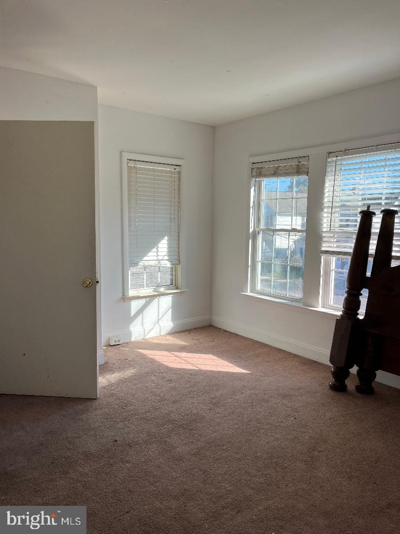 223-225 West High Street Elkton, MD 21921 - Photo 17 of 21 an empty room with windows
