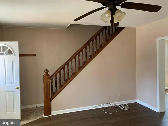 a view of entryway with wooden floor