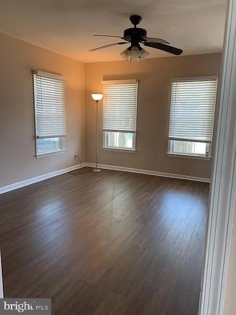223-225 West High Street Elkton, MD 21921 - Photo 4 of 21 a view of an empty room with wooden floor and a window