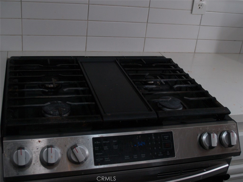 8525 Melosa Way Riverside, CA 92504 - Photo 17 of 27 a close up of a stove top oven