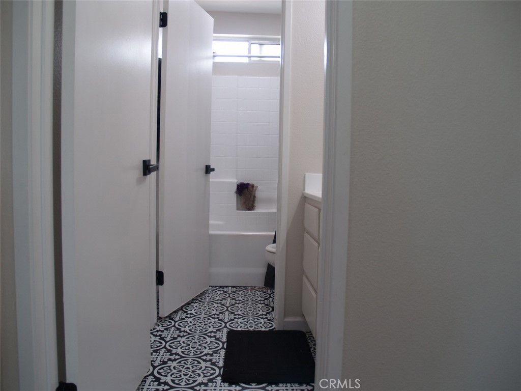 8525 Melosa Way Riverside, CA 92504 - Photo 26 of 27 a bathroom with a sink and a toilet