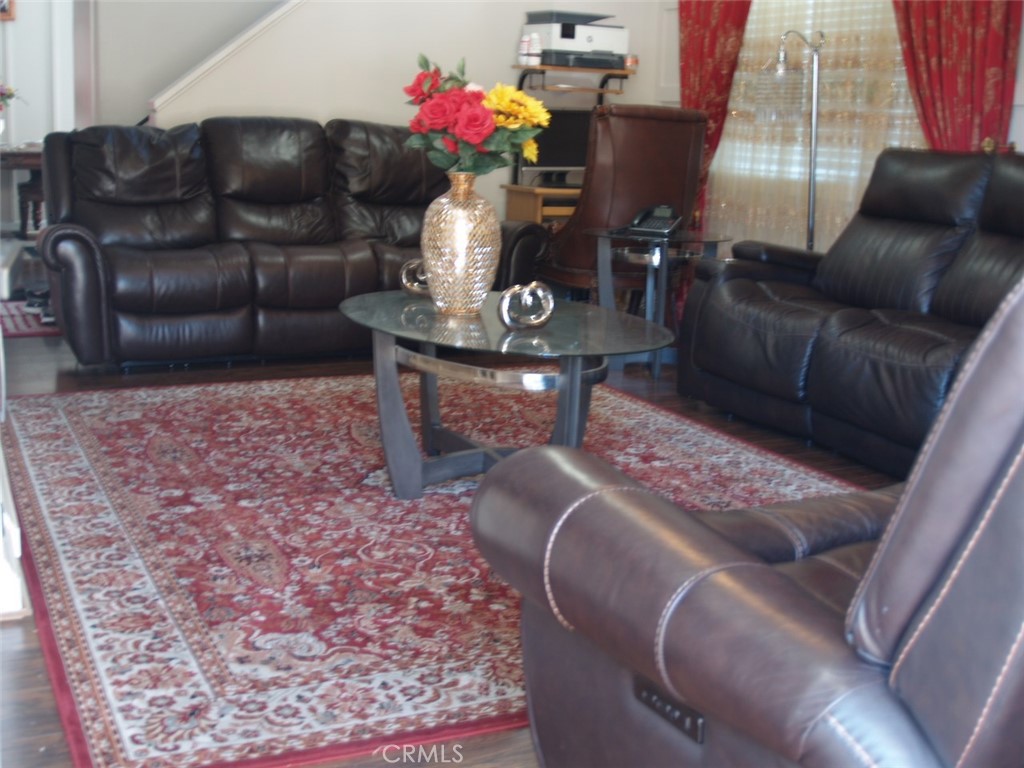 8525 Melosa Way Riverside, CA 92504 - Photo 8 of 27 a living room with furniture and a couch