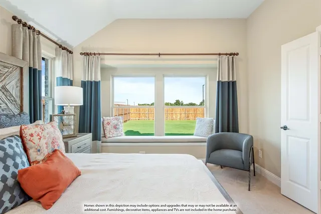 a bedroom with a bed couch and window