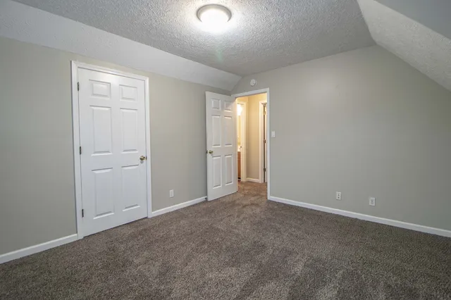 an empty room with closet area