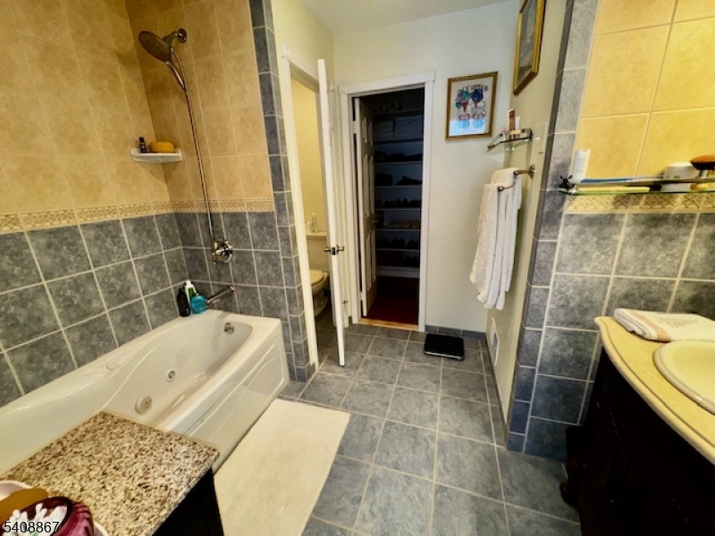 13 Ridgeview Terrace Oak Ridge, NJ 07438 - Photo 14 of 22 a bathroom with a bathtub and shower