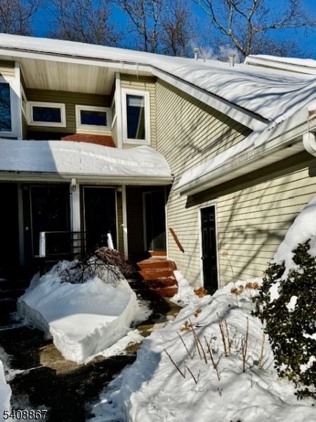 13 Ridgeview Terrace Oak Ridge, NJ 07438 - Photo 21 of 22 a front view of a house with parking space