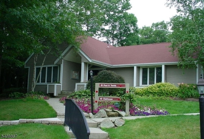 13 Ridgeview Terrace Oak Ridge, NJ 07438 - Photo 22 of 22 a front view of a house with garden