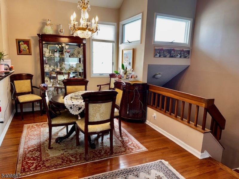 13 Ridgeview Terrace Oak Ridge, NJ 07438 - Photo 9 of 22 a outdoor dining room with furniture a rug and a chandelier