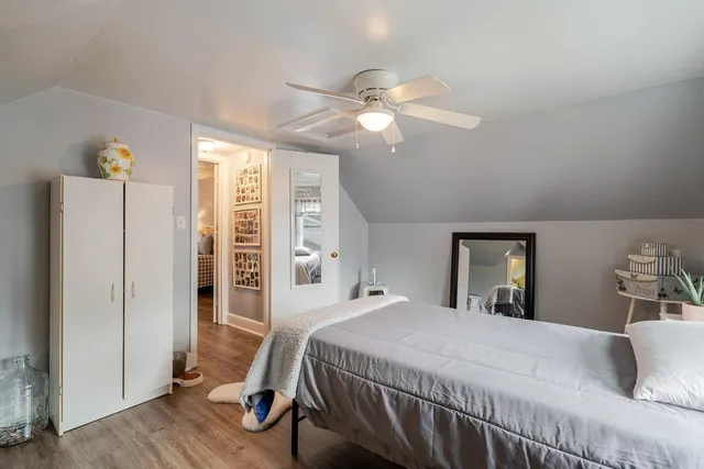 a wooden bench sitting in front of a building