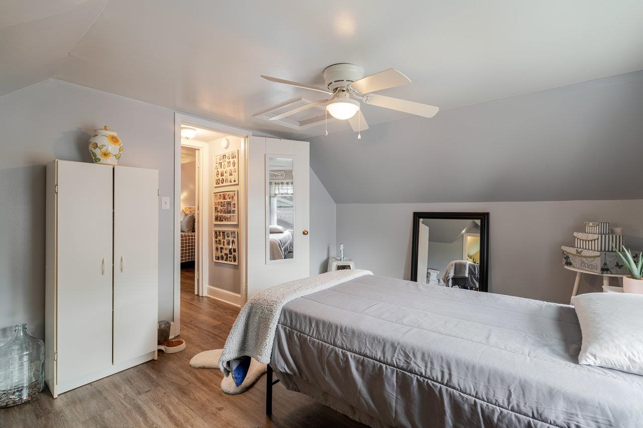 257 Center Street Timberville, VA 22853 - Photo 22 of 73 a bedroom with a bed and wooden floor