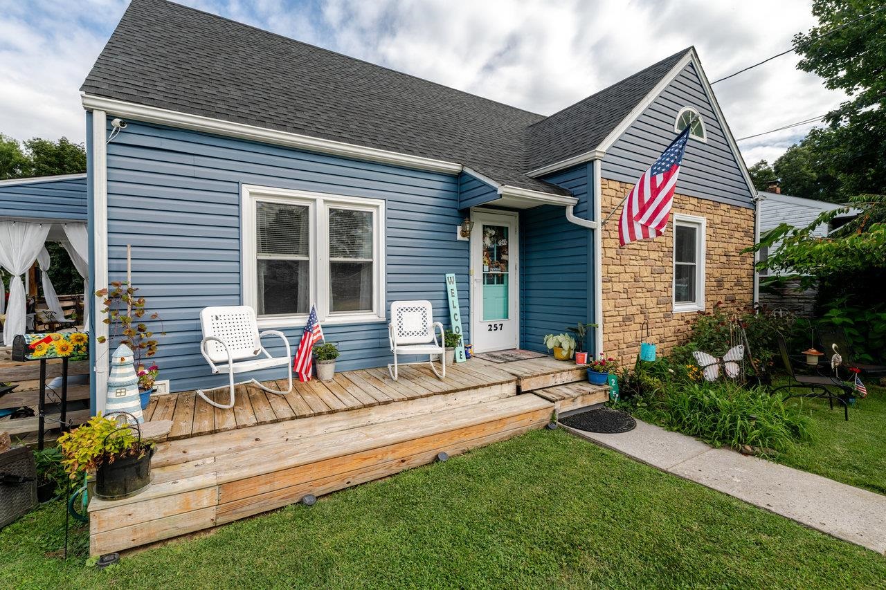 257 Center Street Timberville, VA 22853 - Photo 37 of 73 a bench is sitting in front of house with wooden fence
