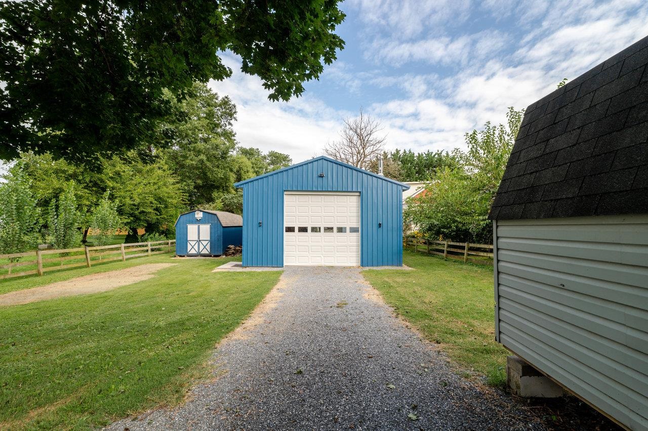 257 Center Street Timberville, VA 22853 - Photo 70 of 73 a front view of a house with a yard and garage