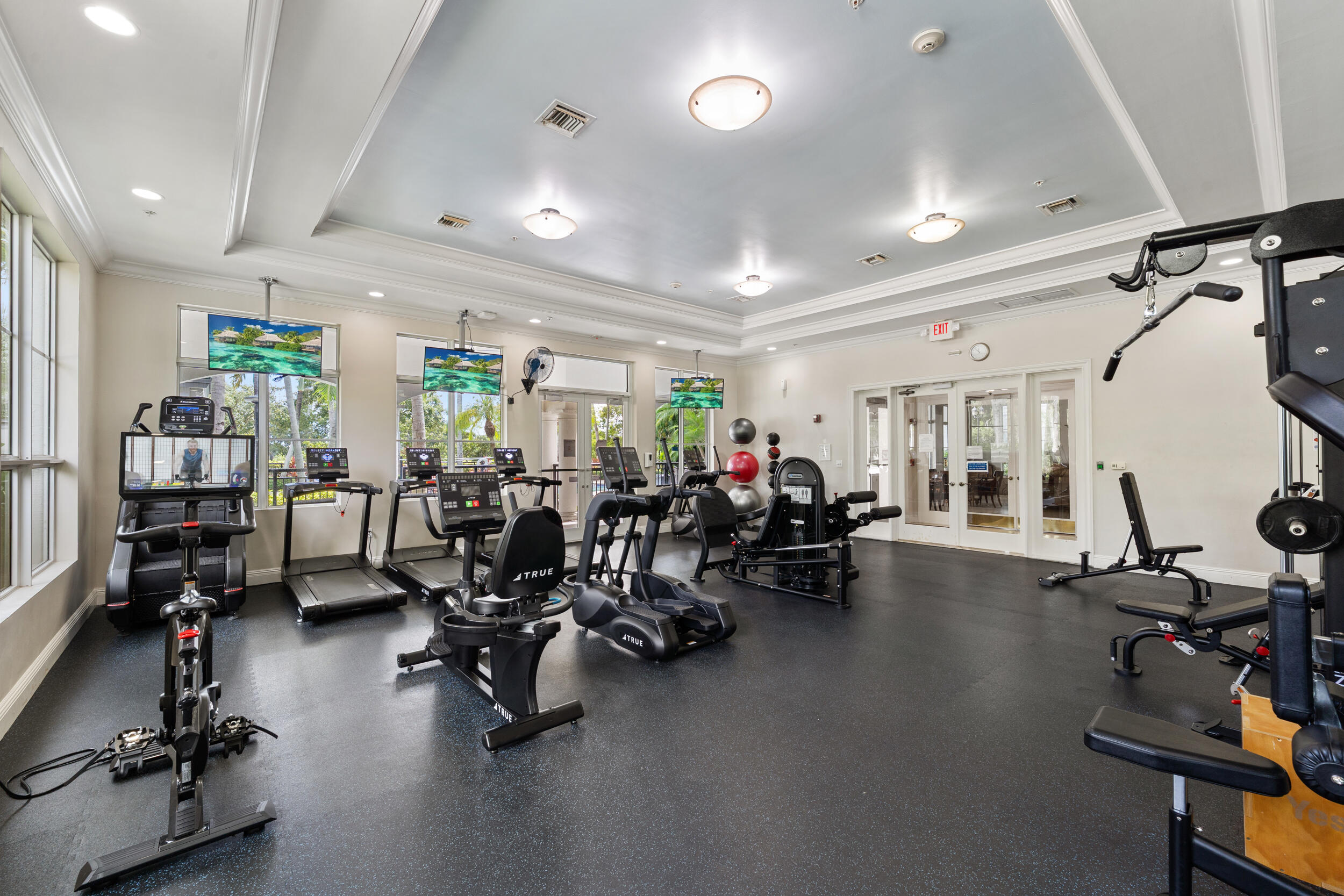 1690 Renaissance Commons Boulevard, Unit 1312 Boynton Beach, FL 33426 - Photo 28 of 39 a view of a room with gym equipment