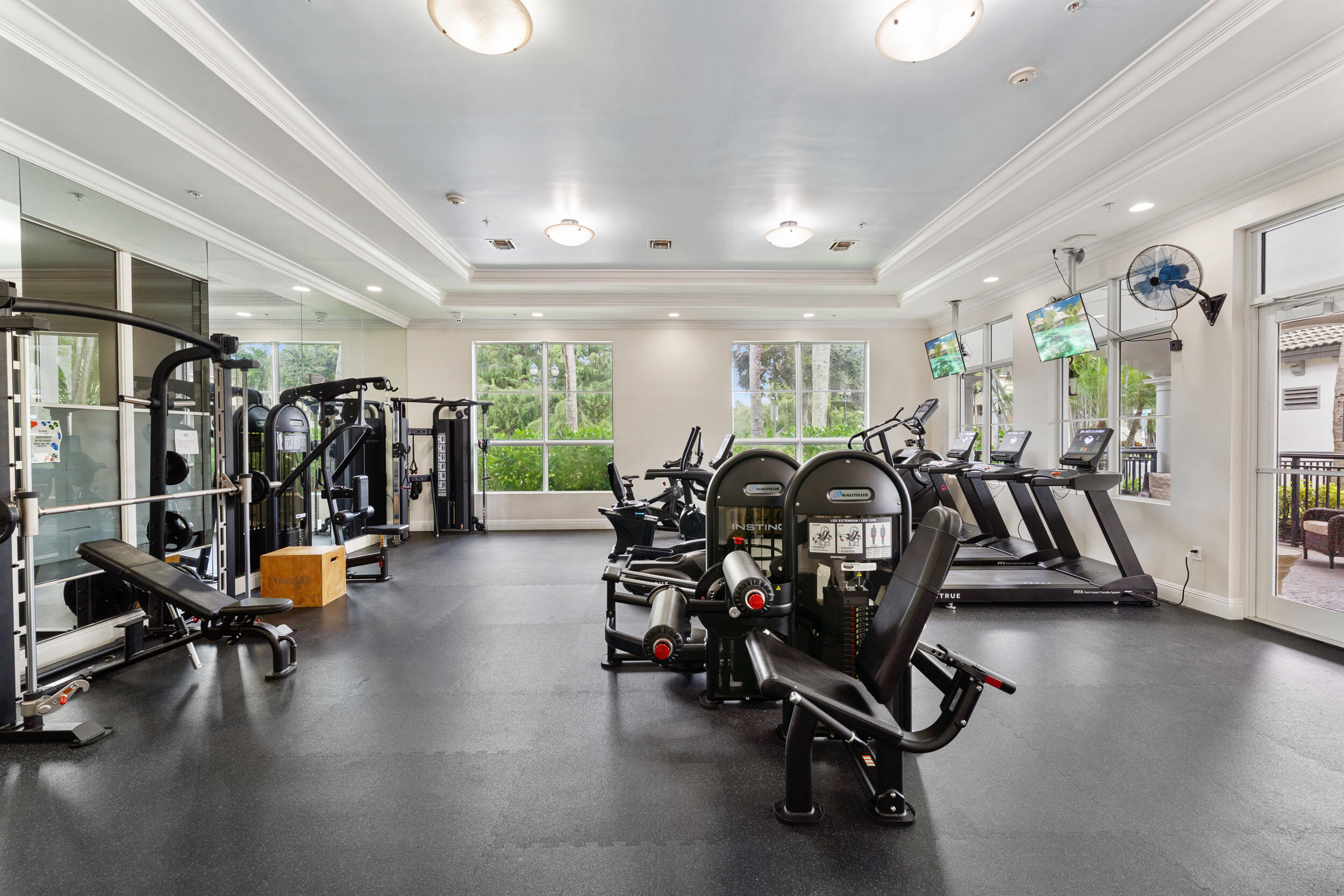 1690 Renaissance Commons Boulevard, Unit 1312 Boynton Beach, FL 33426 - Photo 29 of 39 a view of a room with gym equipment