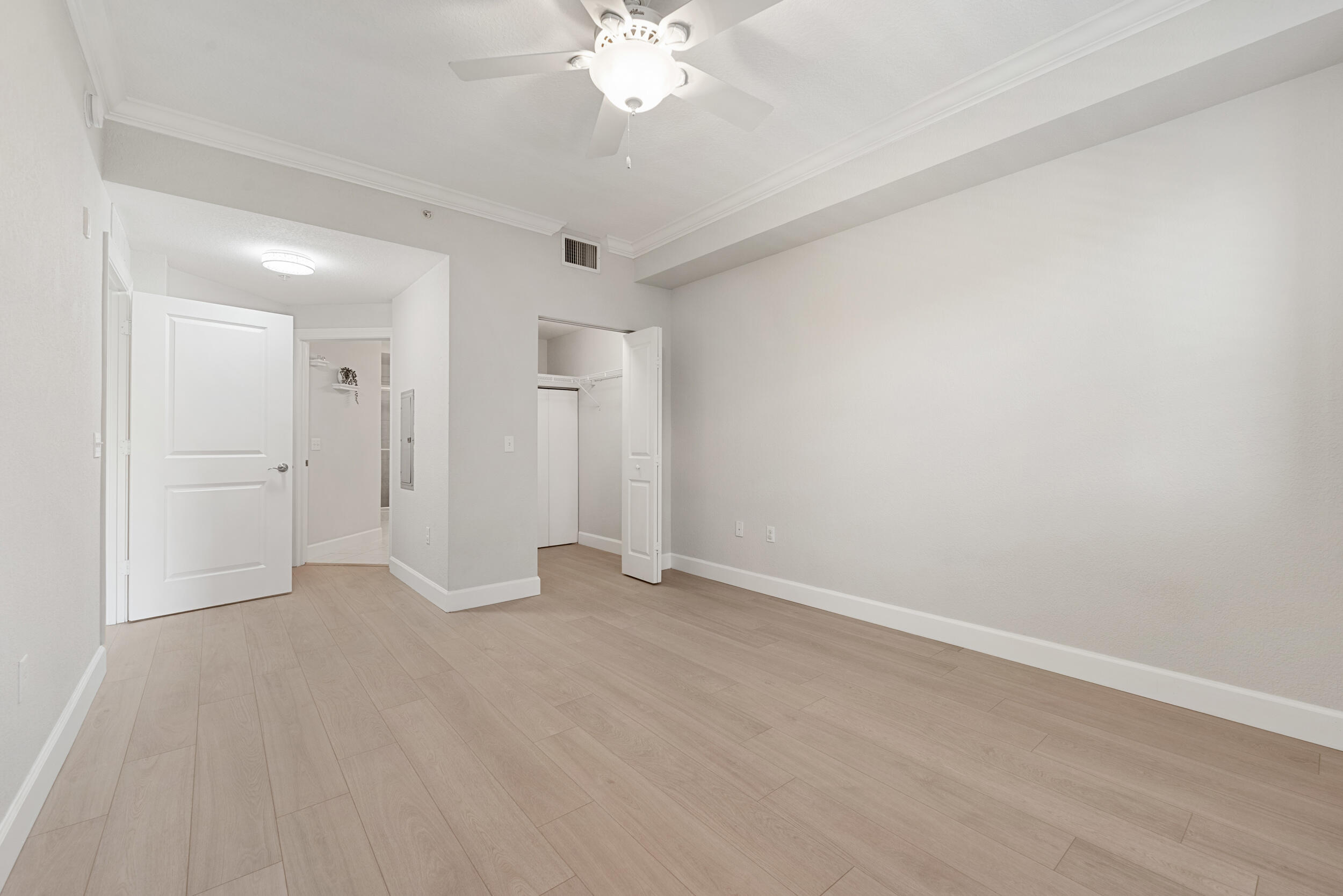 1690 Renaissance Commons Boulevard, Unit 1312 Boynton Beach, FL 33426 - Photo 9 of 39 wooden floor in an empty room