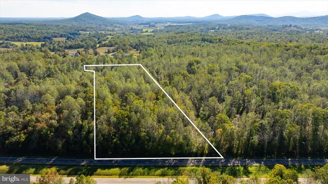 a view of a back yard with a lake view