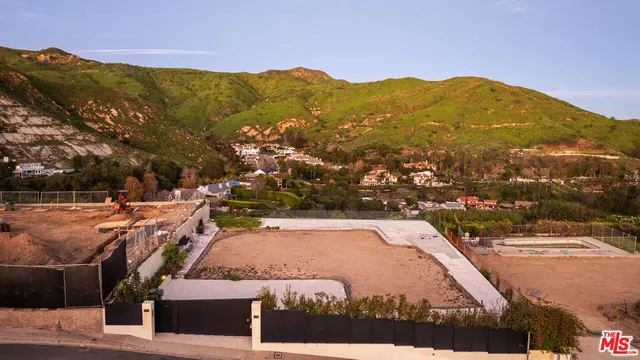 a view of a city with mountains in the background