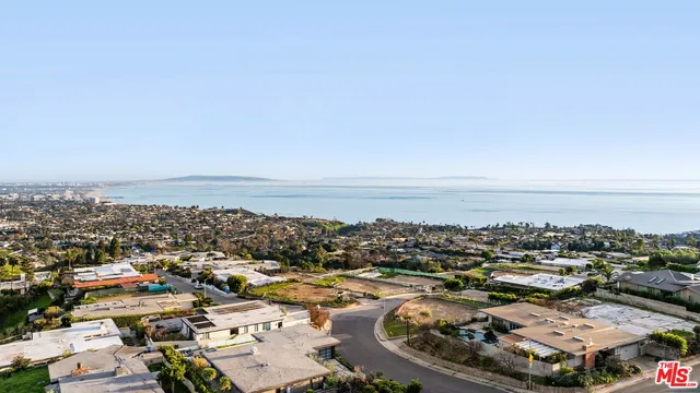 an aerial view of a city with lots of residential buildings