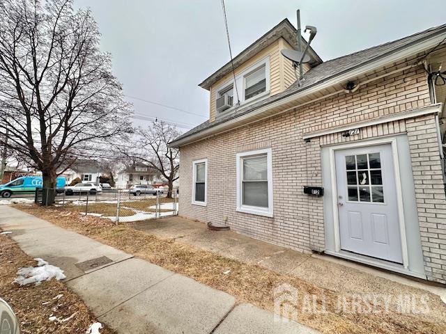 121 Kossuth Street, Unit 2 Somerset, NJ 08873 - Photo 2 of 11 a view of a house with a snow on the road