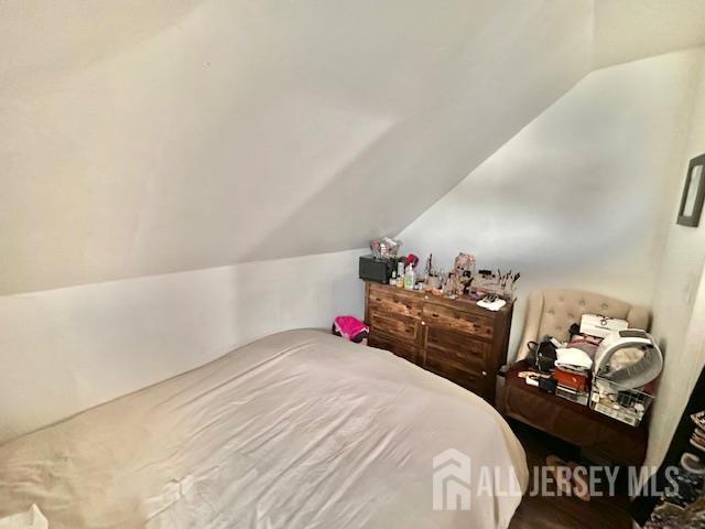 121 Kossuth Street, Unit 2 Somerset, NJ 08873 - Photo 7 of 11 a bedroom with a bed and a night stand
