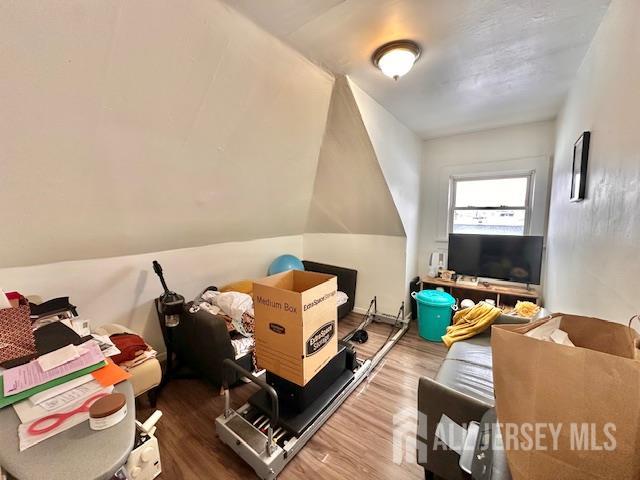 121 Kossuth Street, Unit 2 Somerset, NJ 08873 - Photo 8 of 11 a bedroom with furniture and a bed