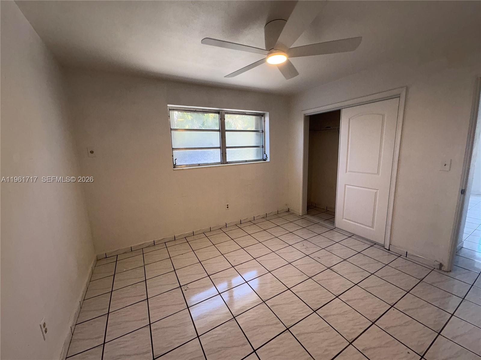 2752 Southwest 25th Terrace, Unit A Miami, FL 33133 - Photo 5 of 7 a view of an empty room and window