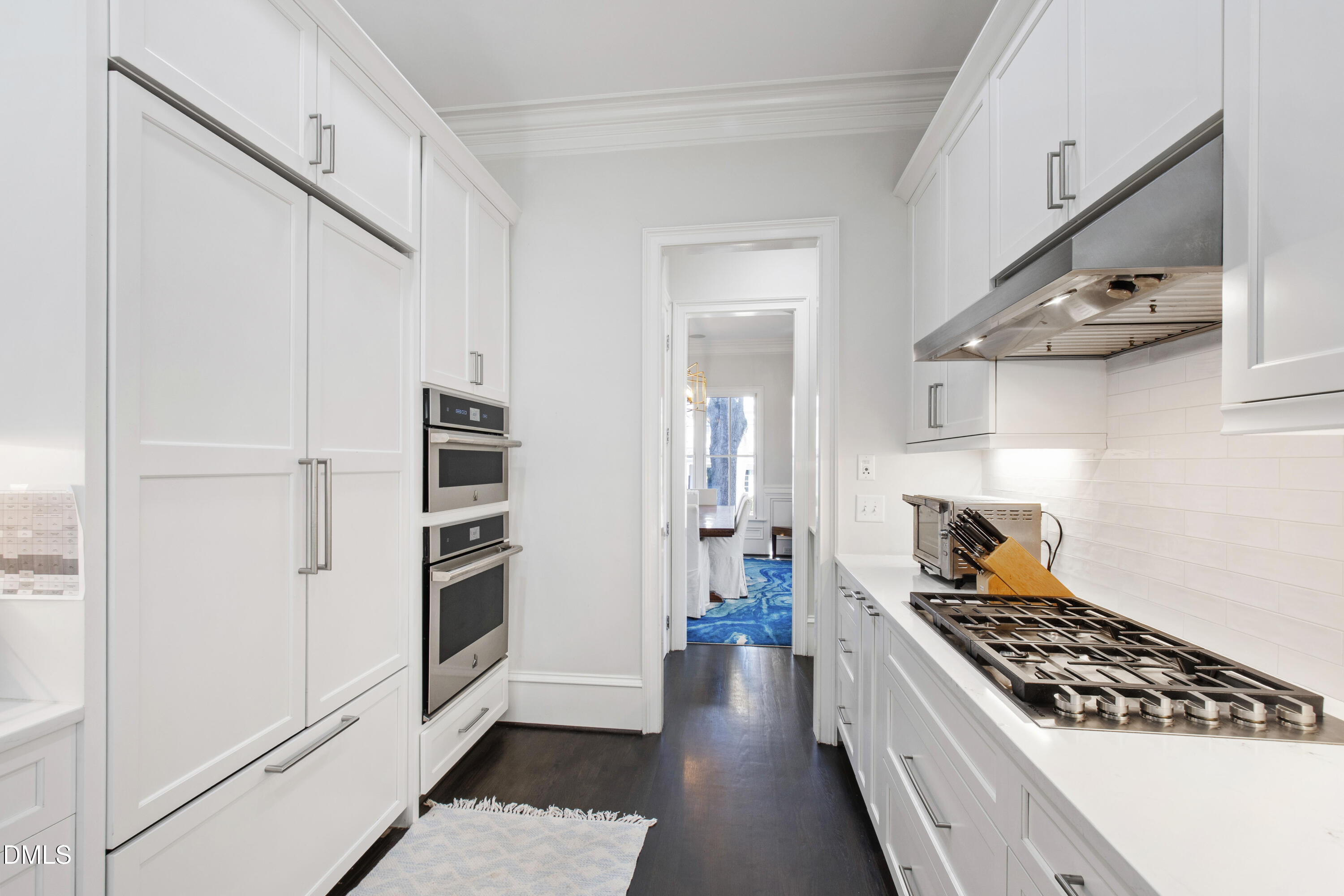 2615 Davis Street Raleigh, NC 27608 - Photo 15 of 61 a kitchen with stainless steel appliances a stove and a refrigerator