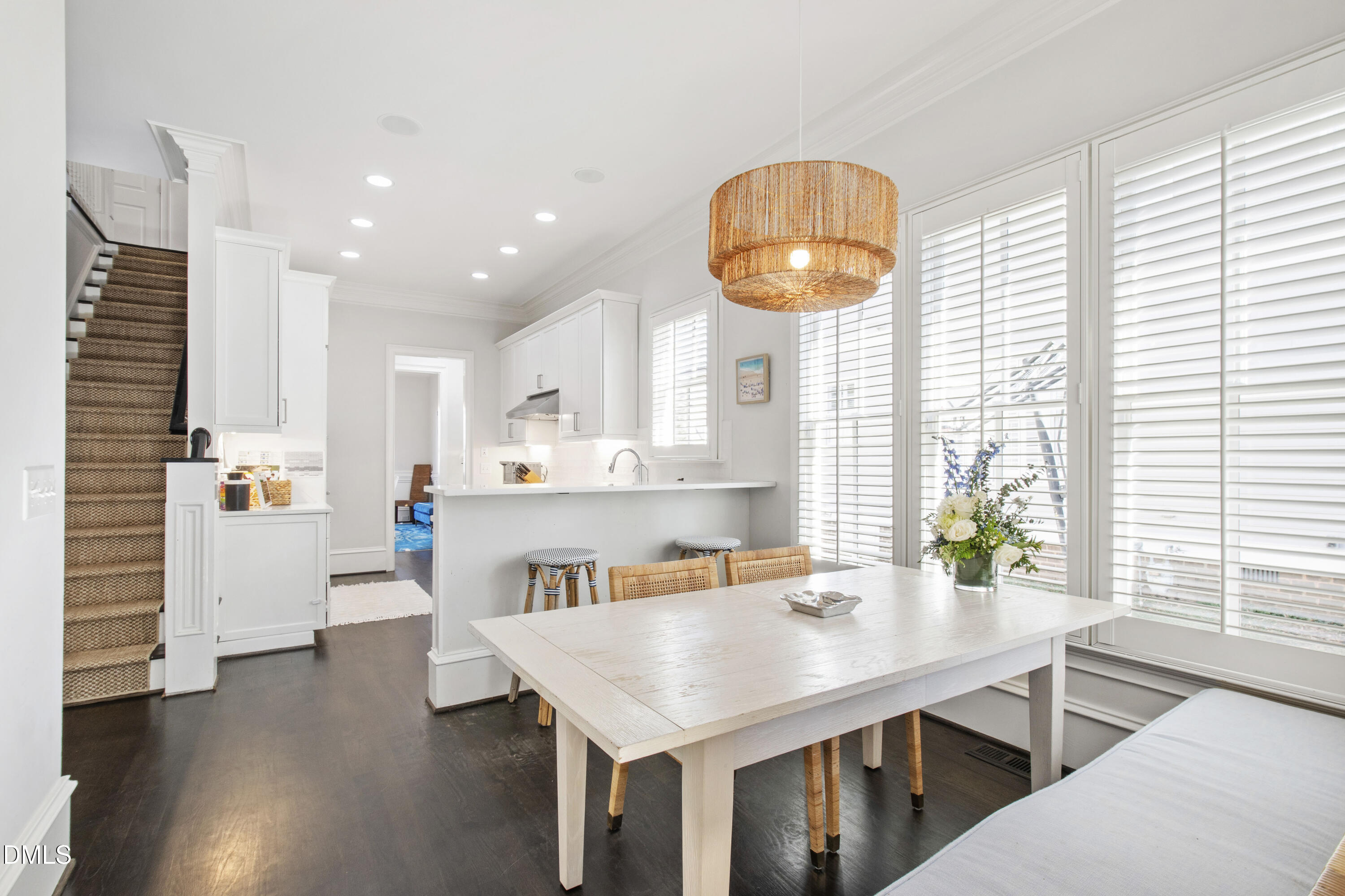 2615 Davis Street Raleigh, NC 27608 - Photo 20 of 61 a open kitchen with stainless steel appliances kitchen island granite countertop a table chairs sink and cabinets