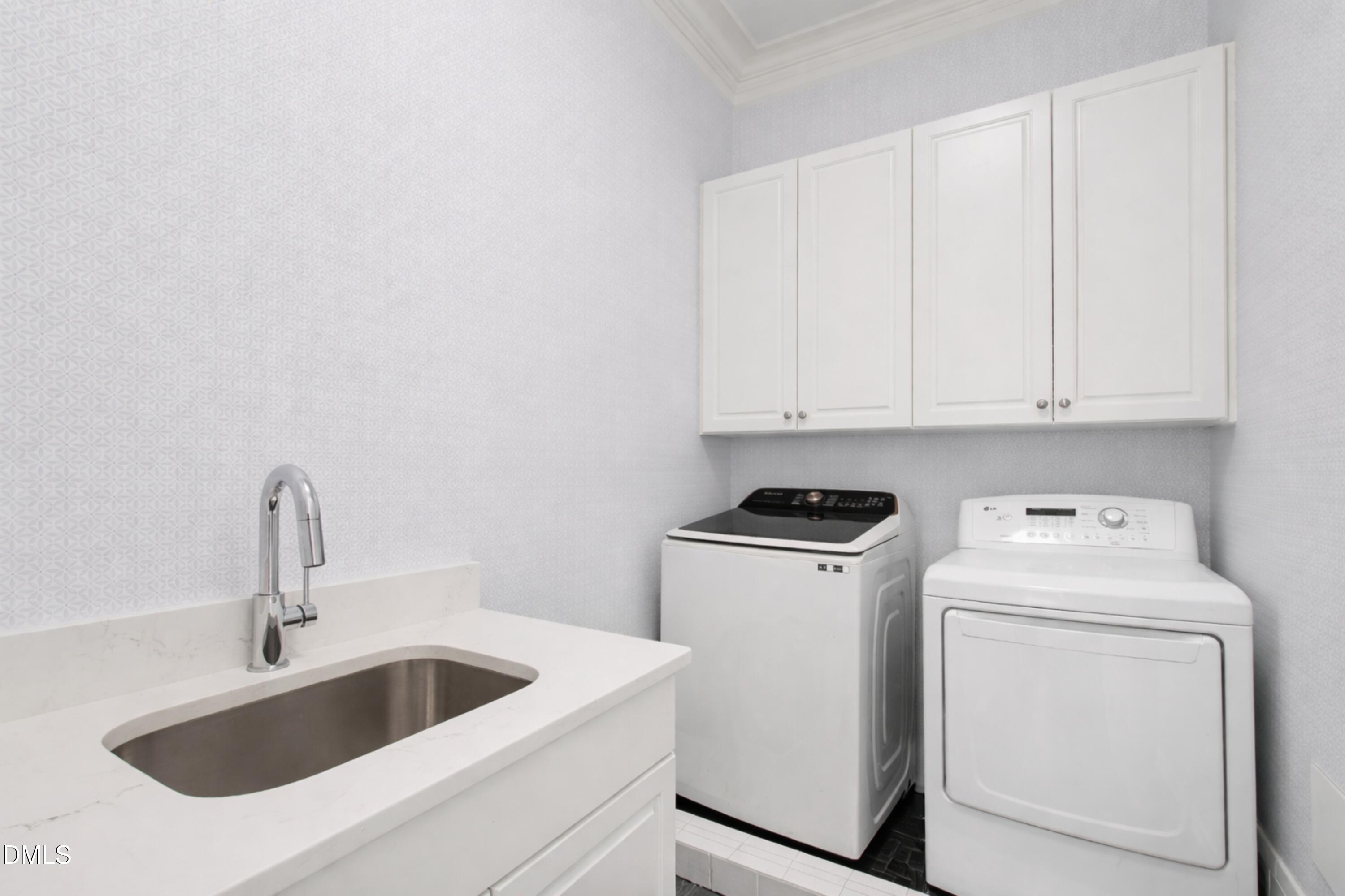 2615 Davis Street Raleigh, NC 27608 - Photo 23 of 61 a view of storage and utility room with washer and dryer