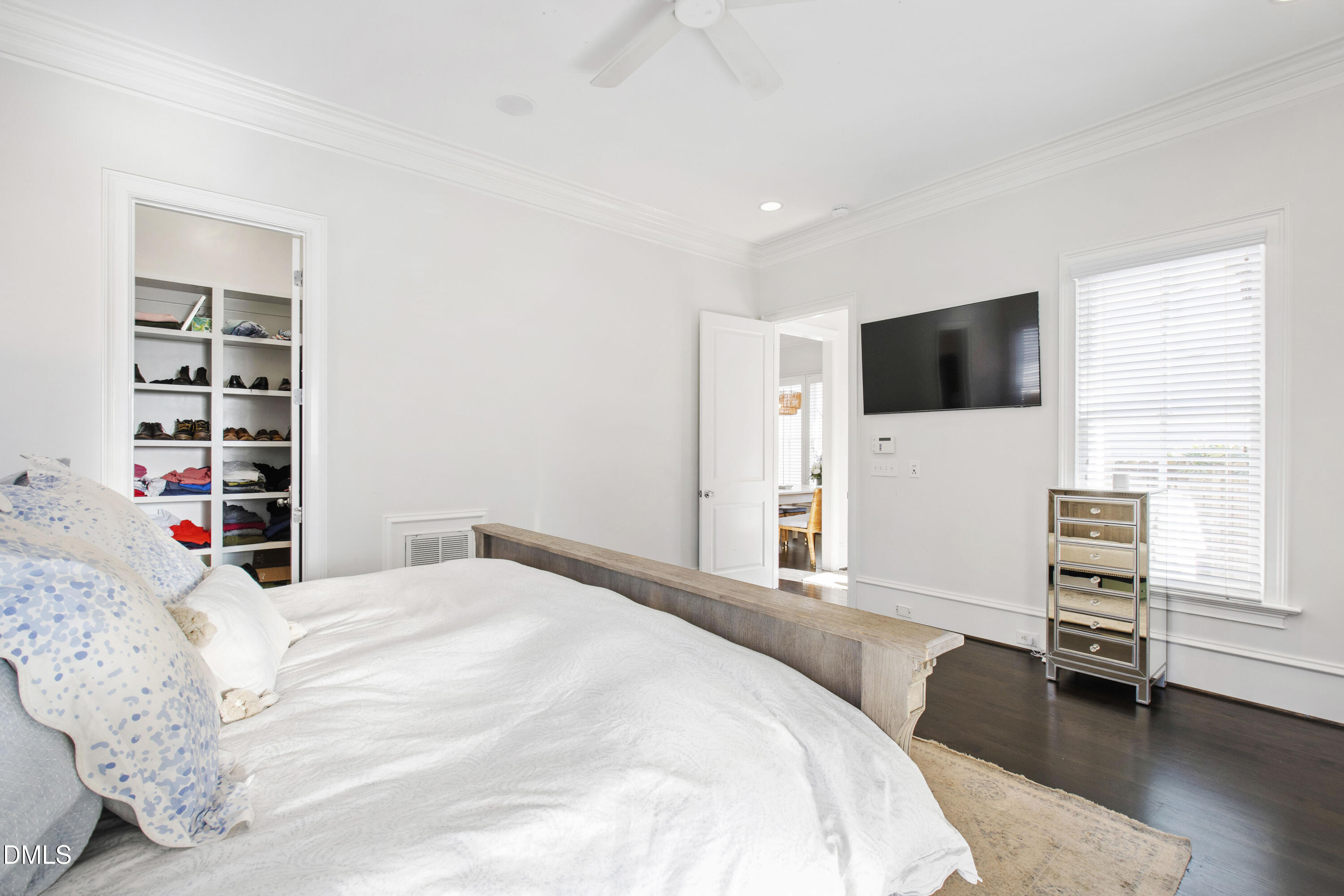 2615 Davis Street Raleigh, NC 27608 - Photo 25 of 61 a bedroom with a bed a television and a window
