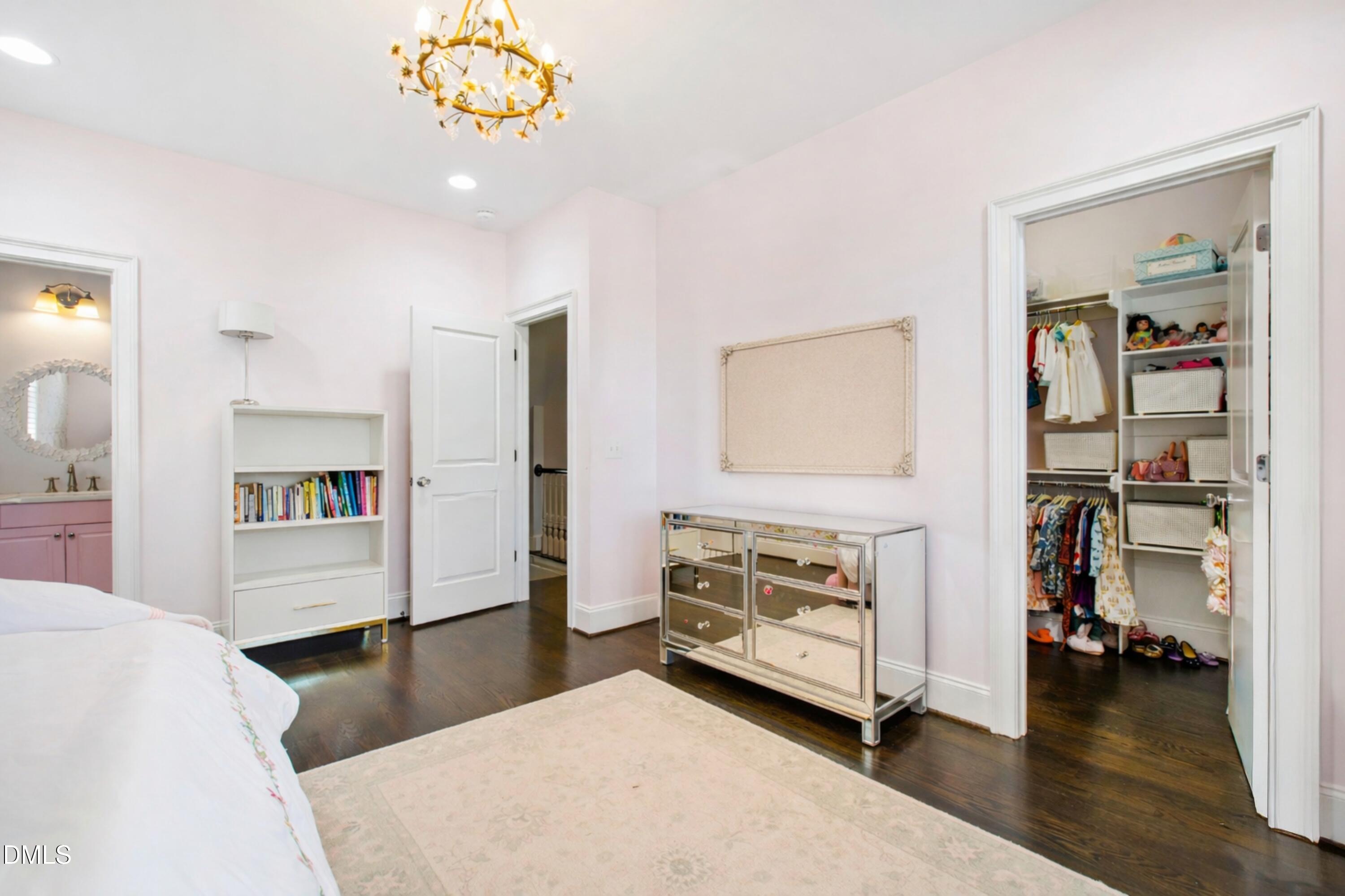 2615 Davis Street Raleigh, NC 27608 - Photo 37 of 61 a bedroom with furniture and a wooden floor