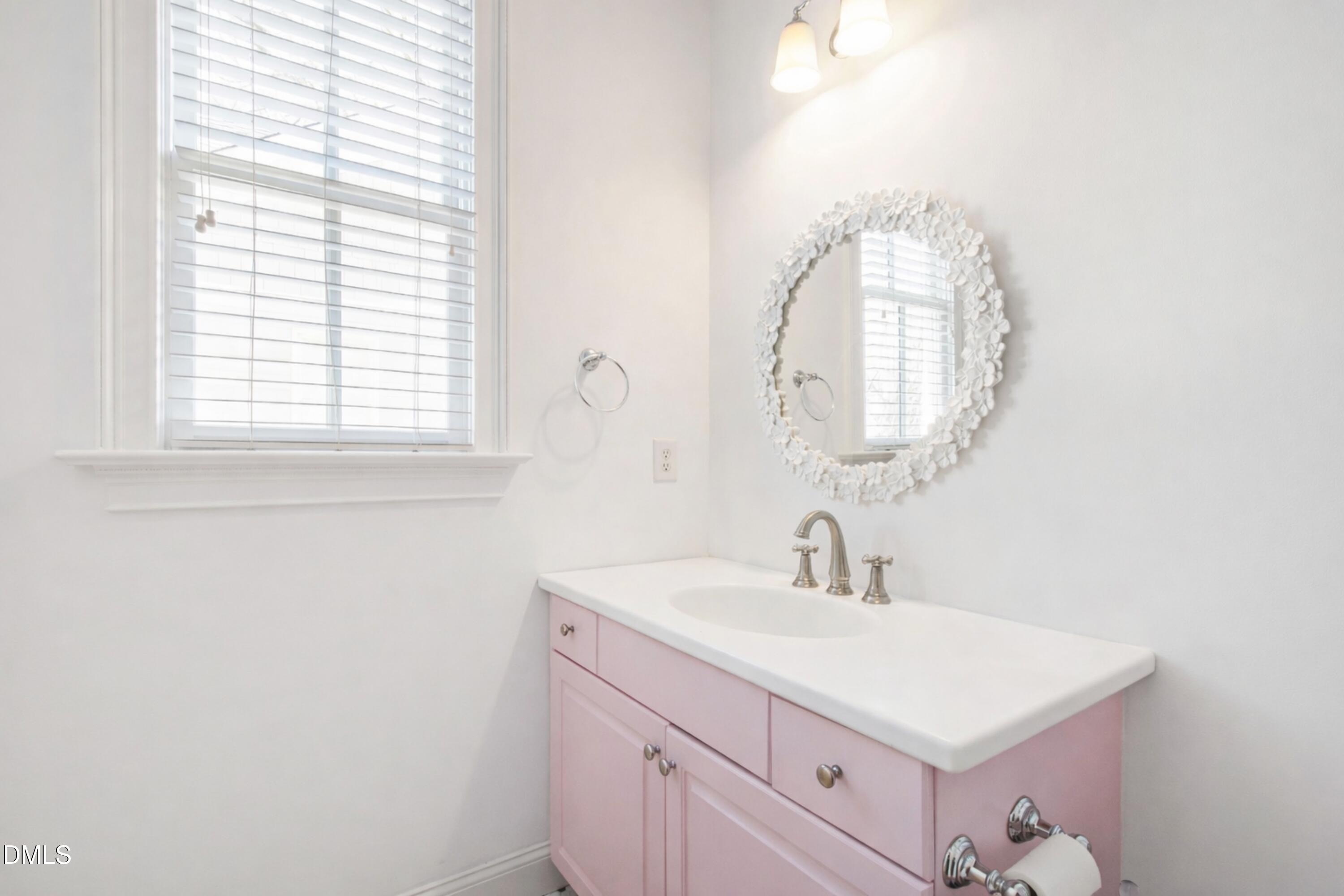 2615 Davis Street Raleigh, NC 27608 - Photo 38 of 61 a bathroom with a sink and a mirror