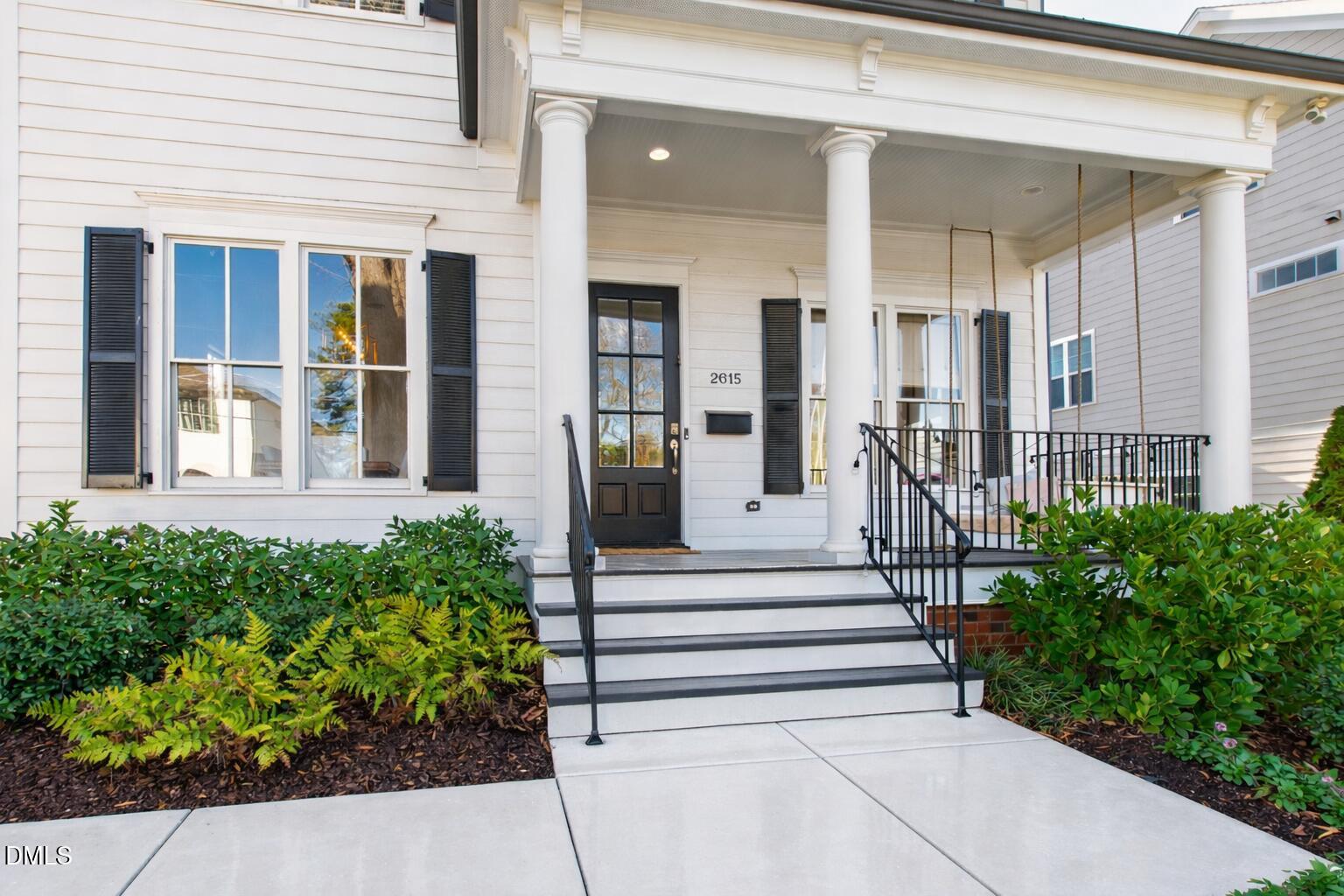 2615 Davis Street Raleigh, NC 27608 - Photo 4 of 61 a front view of a house with a garden