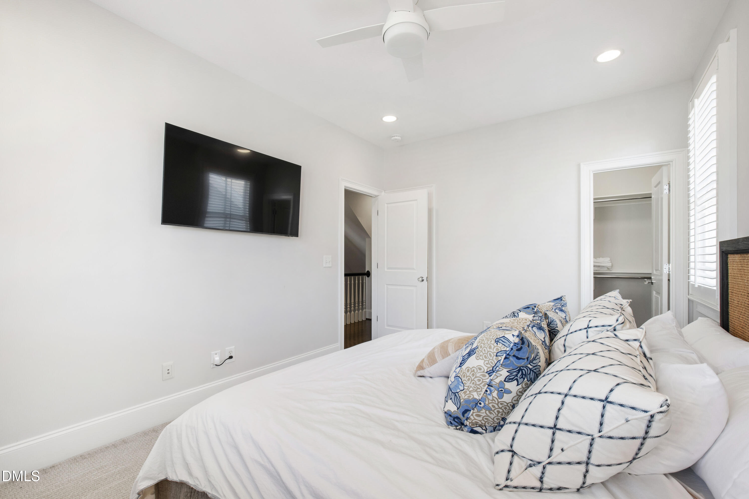 2615 Davis Street Raleigh, NC 27608 - Photo 42 of 61 a bedroom with a bed and a flat screen tv