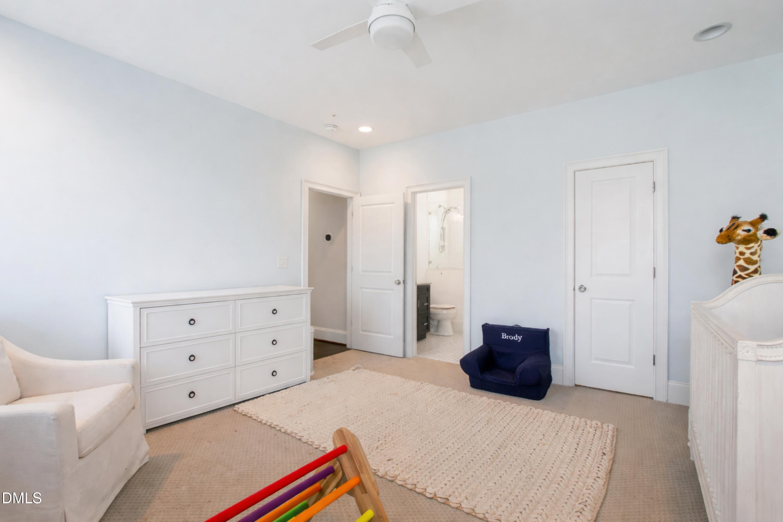 2615 Davis Street Raleigh, NC 27608 - Photo 46 of 61 a bedroom with a bed and a couch