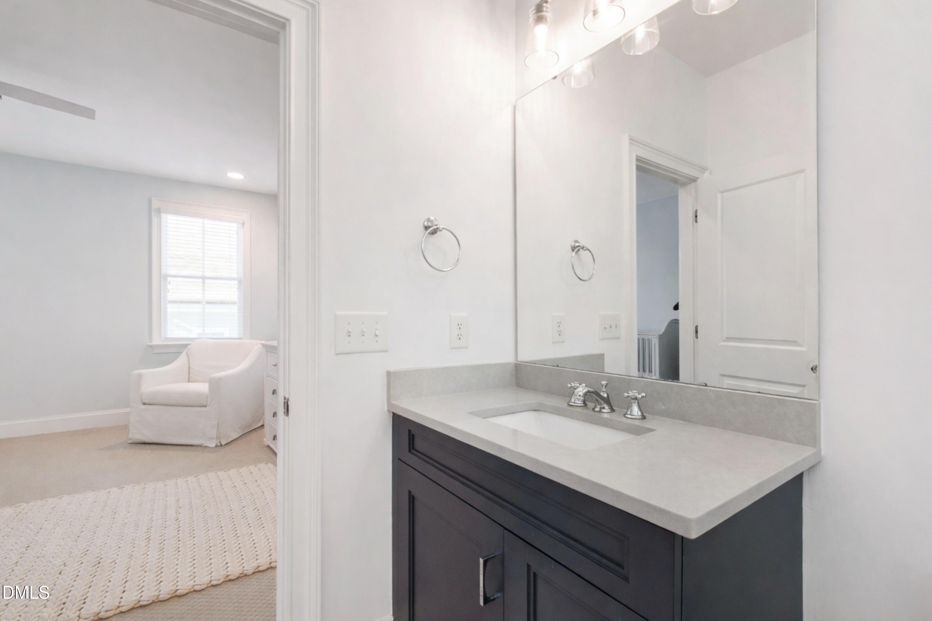 2615 Davis Street Raleigh, NC 27608 - Photo 47 of 61 a bathroom with a sink vanity and a mirror