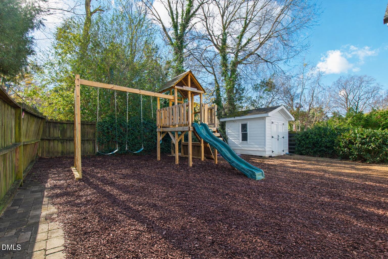 2615 Davis Street Raleigh, NC 27608 - Photo 58 of 61 a view of a house with backyard and a tree