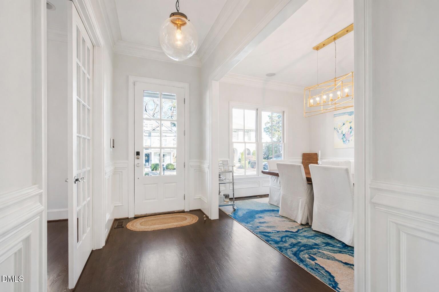 2615 Davis Street Raleigh, NC 27608 - Photo 6 of 61 a view of an entryway with wooden floor and a window