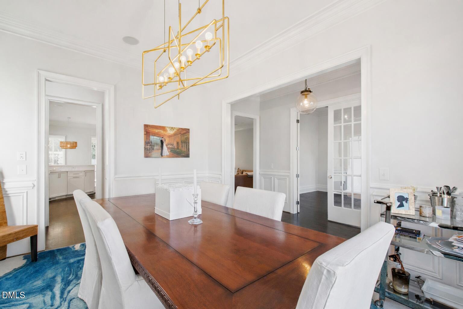 2615 Davis Street Raleigh, NC 27608 - Photo 10 of 61 a living room with furniture a wooden floor and a chandelier