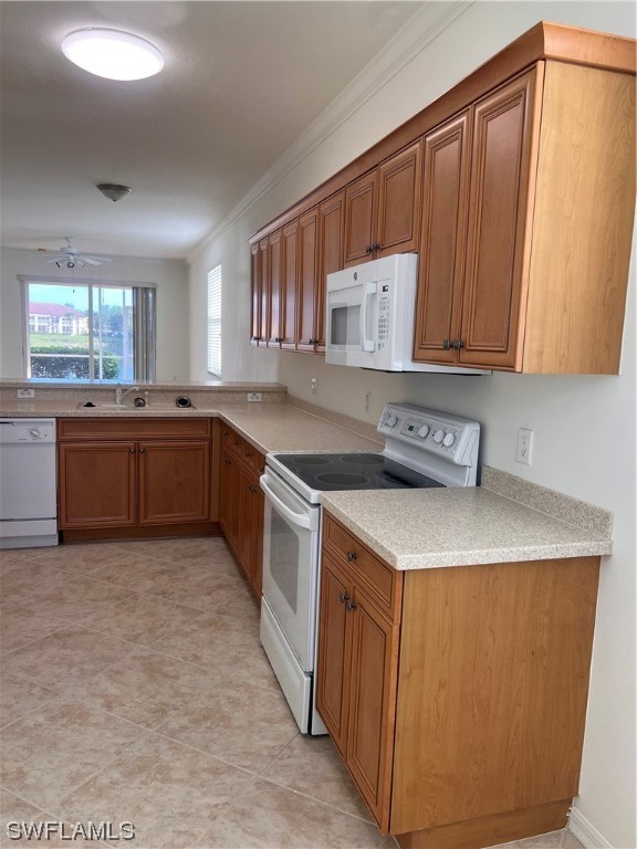 8470 Kingbird Loop, Unit 1020 Estero, FL 33967 - Photo 7 of 17 a kitchen with stainless steel appliances granite countertop a sink stove and refrigerator
