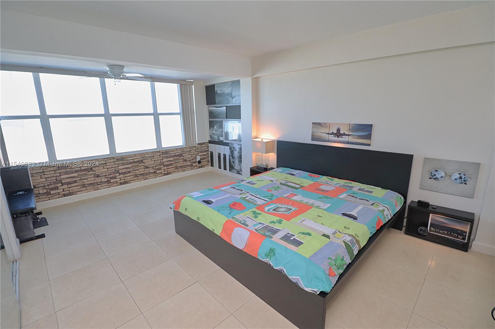 1801 South Surf Road, Unit 2E Hollywood, FL 33019 - Photo 11 of 24 a bedroom with a bed next to a window