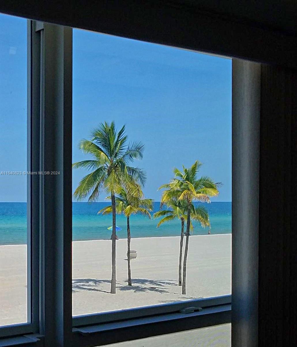 1801 South Surf Road, Unit 2E Hollywood, FL 33019 - Photo 14 of 24 a vase of flowers sitting on a window sill