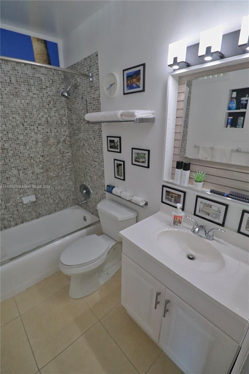1801 South Surf Road, Unit 2E Hollywood, FL 33019 - Photo 16 of 24 a bathroom with a sink a toilet and shower