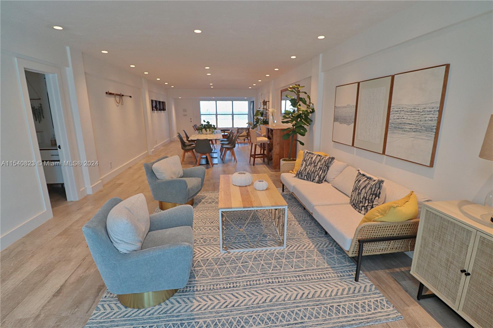 1801 South Surf Road, Unit 2E Hollywood, FL 33019 - Photo 19 of 24 a living room with furniture and a glass door