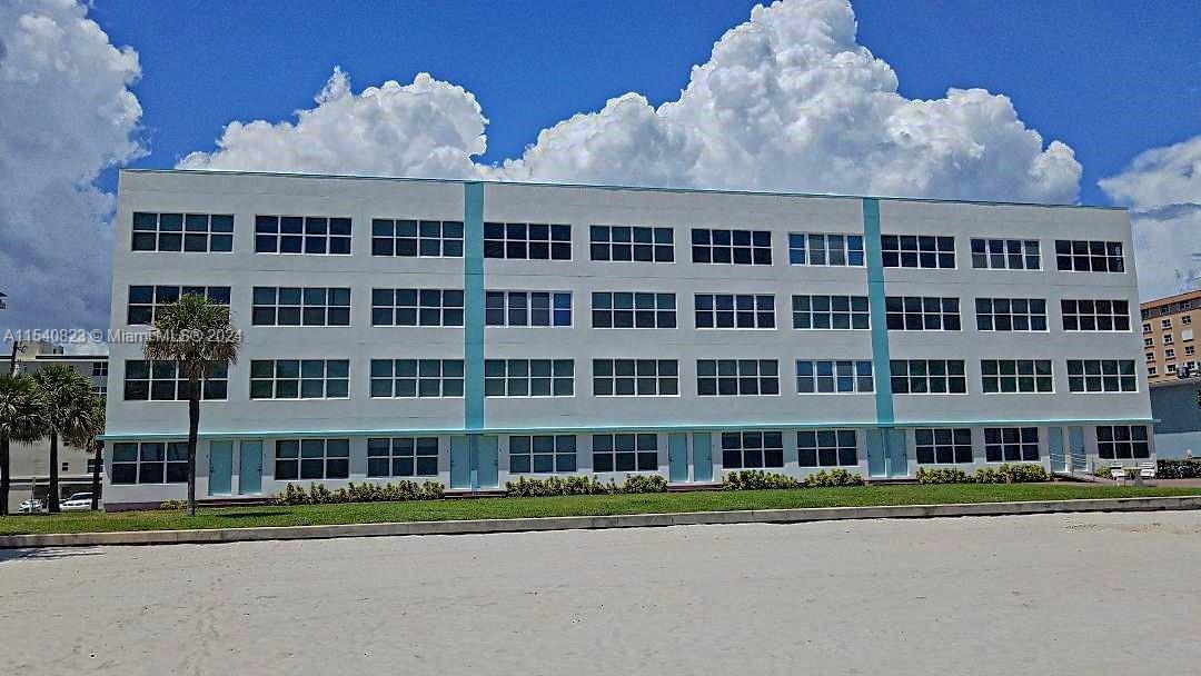 1801 South Surf Road, Unit 2E Hollywood, FL 33019 - Photo 2 of 24 a front view of a building with street